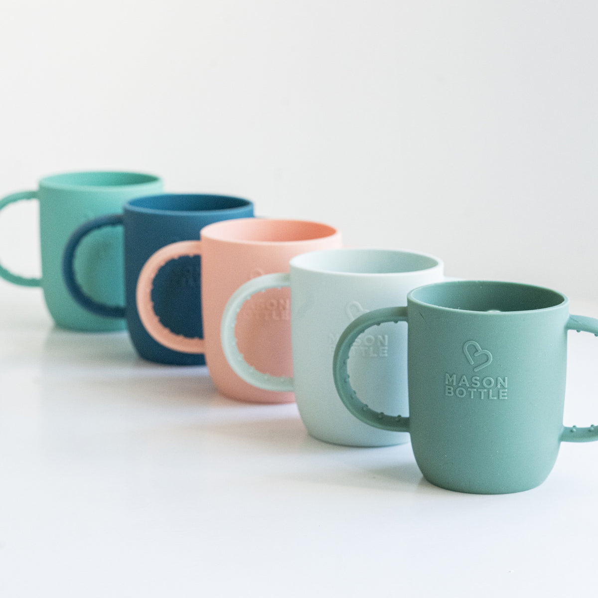 Set of colorful silicone sleeves with 'Mason Bottle' branding on a white background
